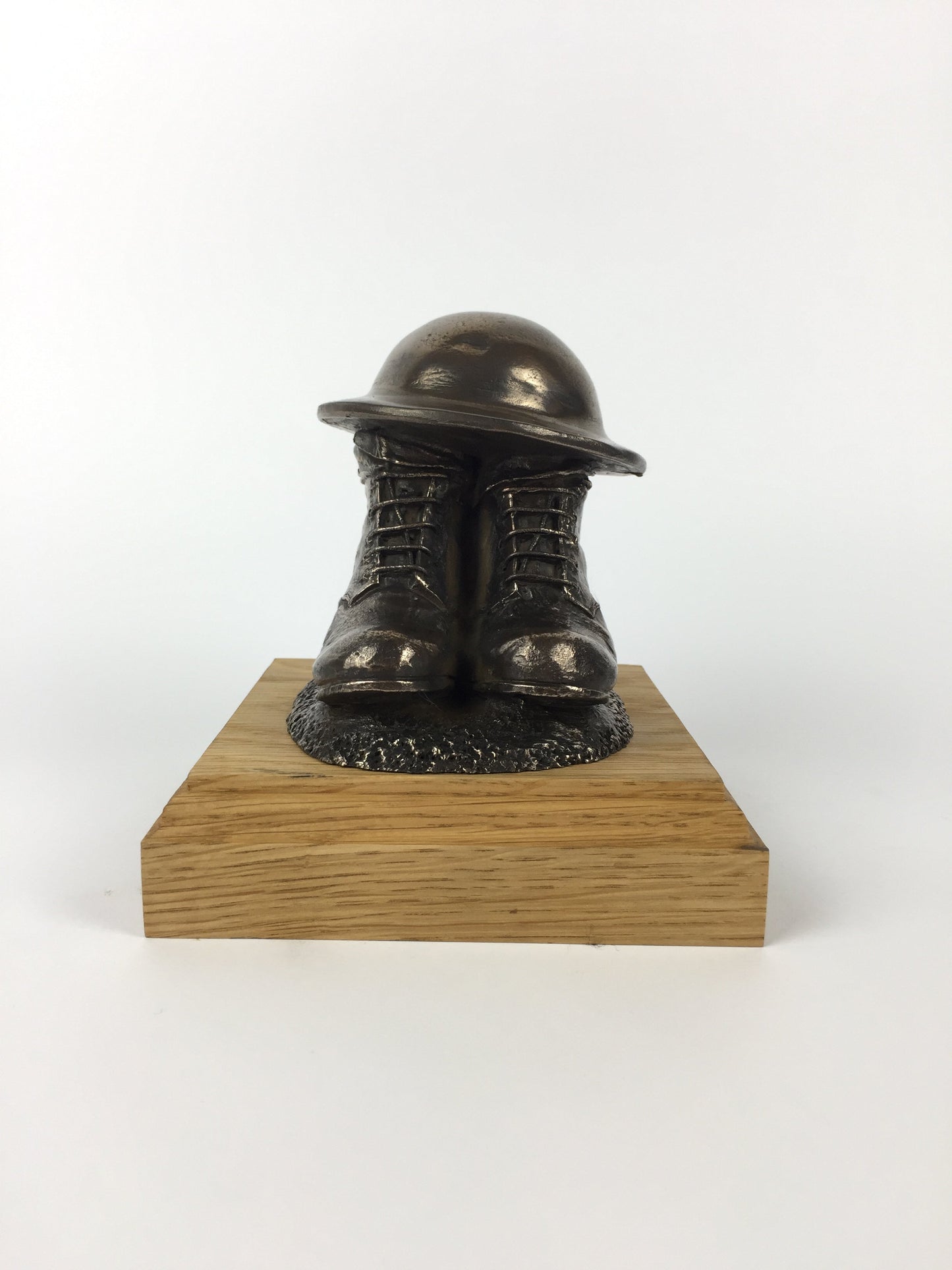 First World War Boots, Helmet, and Putty's Cold Cast Bronze Statue