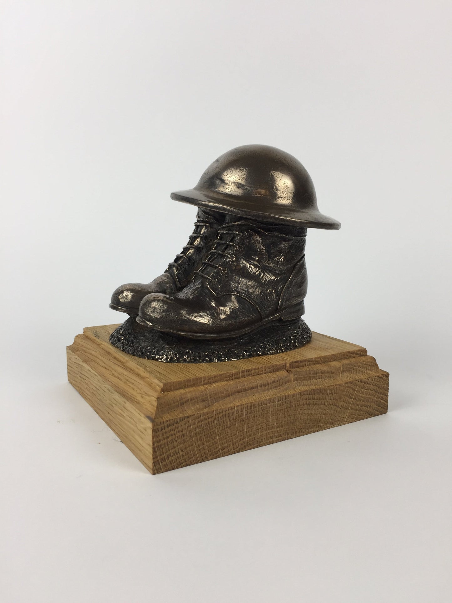 First World War Boots, Helmet, and Putty's Cold Cast Bronze Statue