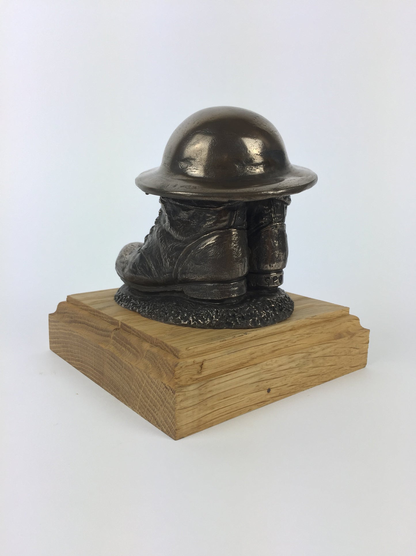 First World War Boots, Helmet, and Putty's Cold Cast Bronze Statue