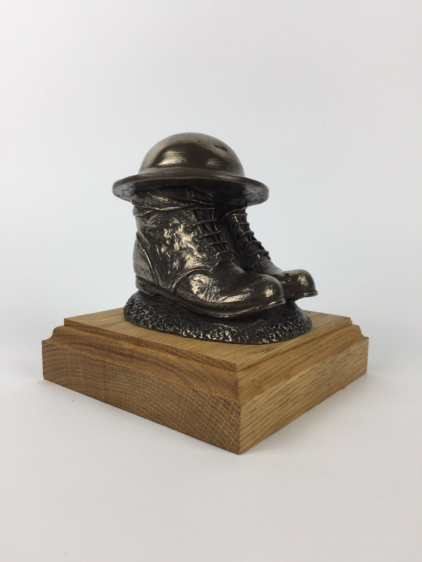 First World War Boots, Helmet, and Putty's Cold Cast Bronze Statue